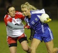 Monaghan's Caoimhe Mohan gets a tug on her jersey from Tyrone's Tori McLaughlin