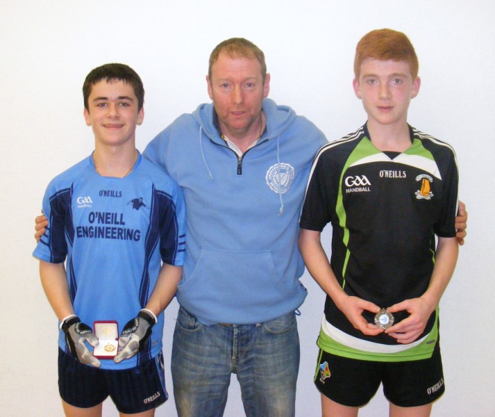 Under-16 county finalists Sean Kerr (winner) and Niall Allison, pictured with Martin Mullan from the county handball committee-